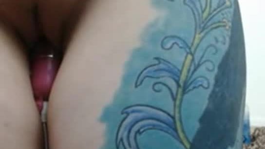 Tattooed girl with big boobs riding fake cock